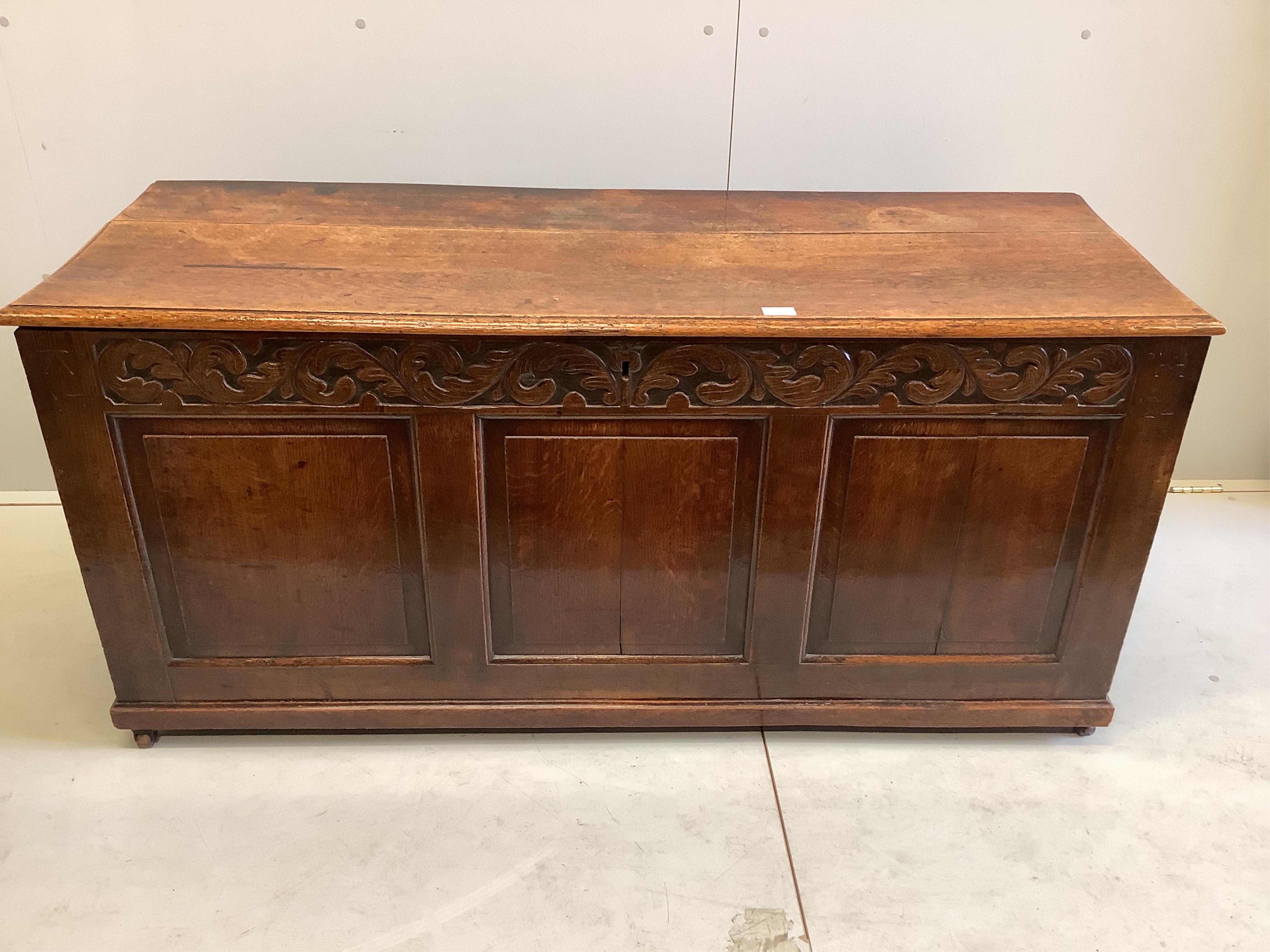 An 18th century oak coffer, width 148cm, depth 52cm, height 68cm. Condition - fair